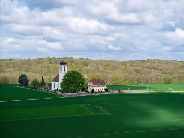 Framed Print : Small church with cemetery in the middle of blooming fruit trees and fields captured with a drone in spring Framed Print : Small church with cemetery in the middle of blooming fruit trees and fields captured with a drone in spring