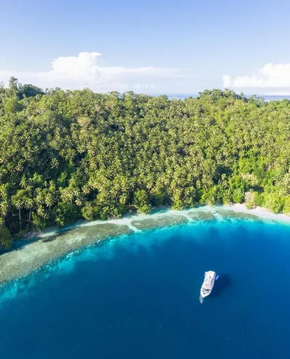 Framed Print : A small dive boat is anchored off the coast of Papua New Guinea. This tropical area is part of the Coral Triangle due to its high marine biodiversity Framed Print : A small dive boat is anchored off the coast of Papua New Guinea. This tropical area is part of the Coral Triangle due to its high marine biodiversity