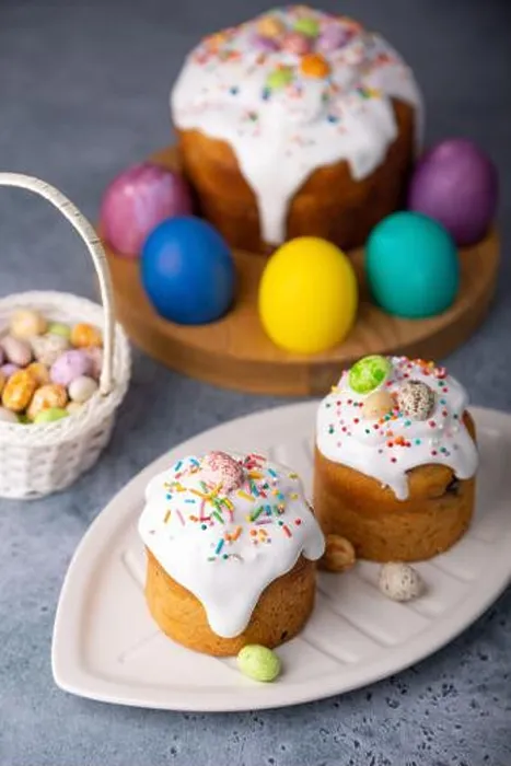 Framed Print : Two small Easter kulichs with candied fruits in white glaze with colorful sprinkles in the cut Framed Print : Two small Easter kulichs with candied fruits in white glaze with colorful sprinkles in the cut