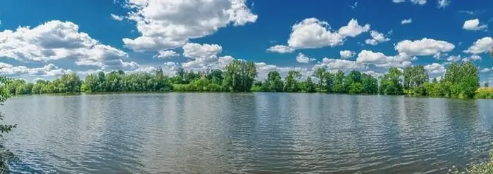 Framed Print : A small flat lake against the sky with clouds. Trees on the shore of the reservoir. Summer holidays, fishing Framed Print : A small flat lake against the sky with clouds. Trees on the shore of the reservoir. Summer holidays, fishing