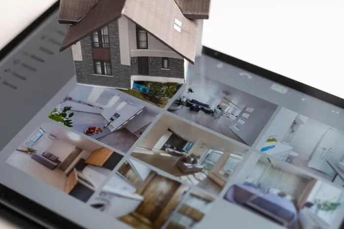 Framed Print : Small house model is on screen tablet and icons home electronics devices connecting with wireless
