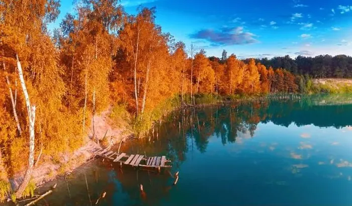 Framed Print : A small island in the middle of the lake, yellow autumn leaves on the trees. Drone view Framed Print : A small island in the middle of the lake, yellow autumn leaves on the trees. Drone view