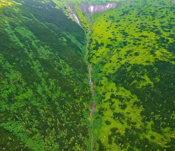 Framed Print : A small stream flowing out of the top of the Carpathian Mountains, general view from the drone. Summer mountains Framed Print : A small stream flowing out of the top of the Carpathian Mountains, general view from the drone. Summer mountains