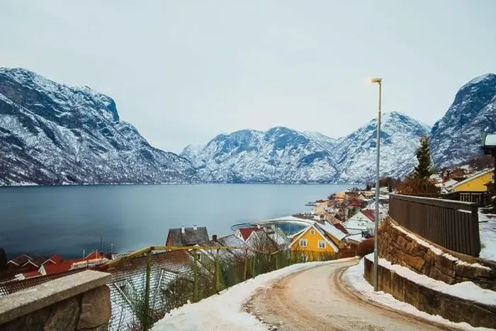 Framed Print : Small town near sea and snowy mountains Framed Print : Small town near sea and snowy mountains