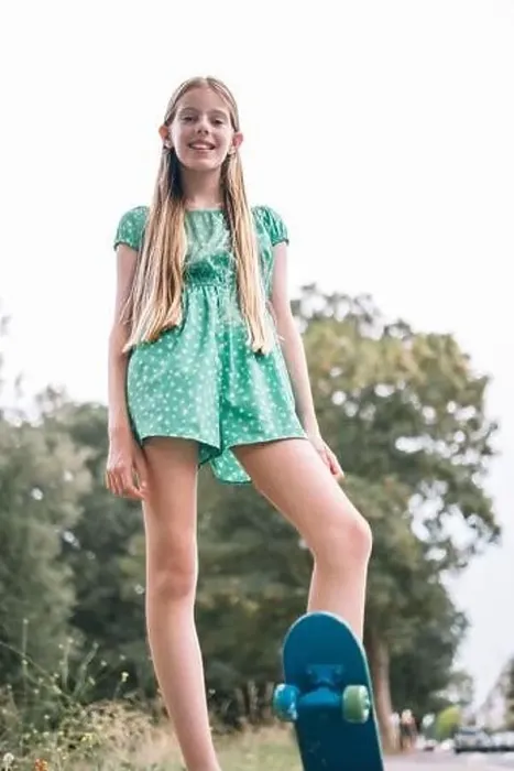 Framed Print : Smiling blond girl with skateboard in park Framed Print : Smiling blond girl with skateboard in park