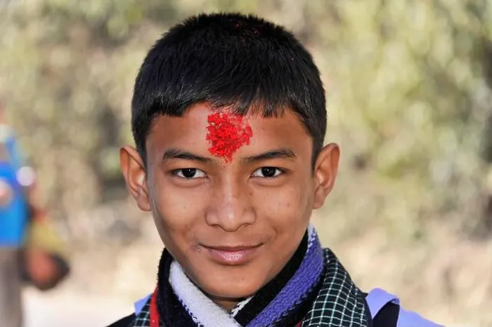 Framed Print : A smiling boy with a red mark on his forehead outdoors, Bhairahawa, Nepal Framed Print : A smiling boy with a red mark on his forehead outdoors, Bhairahawa, Nepal