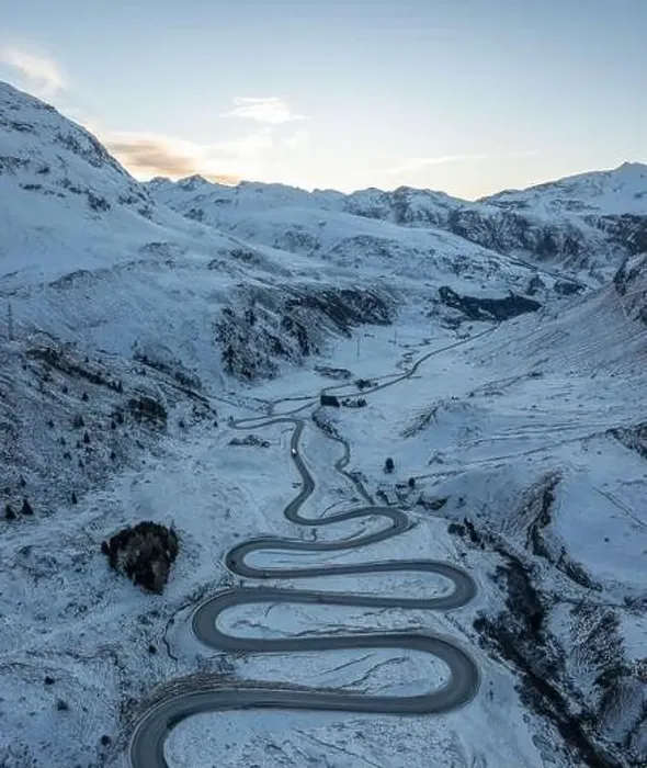 Framed Print : A snake shaped pass road in winter photographed from above Framed Print : A snake shaped pass road in winter photographed from above