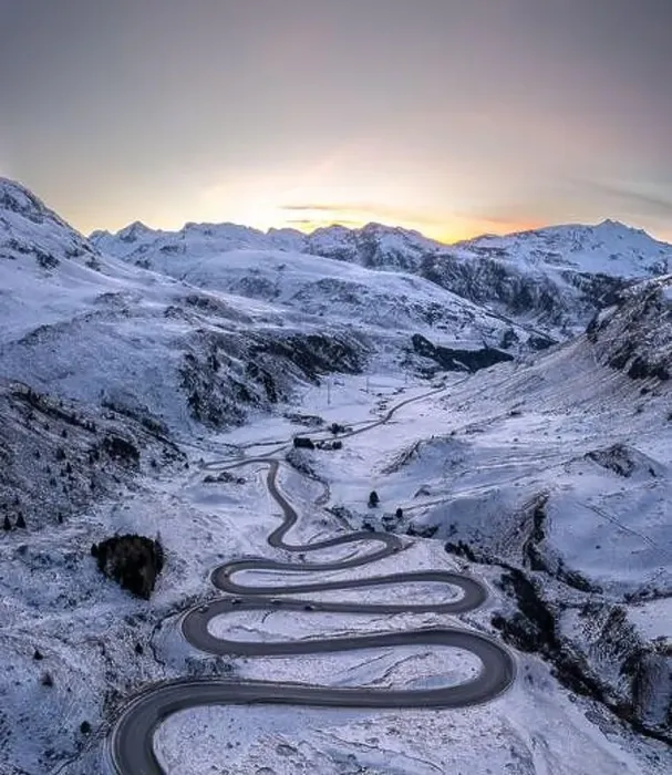 Framed Print : A snake shaped pass road in winter photographed from above Framed Print : A snake shaped pass road in winter photographed from above