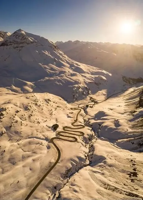 Framed Print : Snake shaped pass road in winter during sunset Framed Print : Snake shaped pass road in winter during sunset