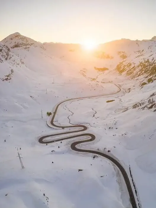 Framed Print : Snake shaped pass road in winter during sunset Framed Print : Snake shaped pass road in winter during sunset