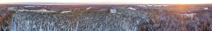 Framed Print : Snow covered winter forest view from drone during sunrise Framed Print : Snow covered winter forest view from drone during sunrise