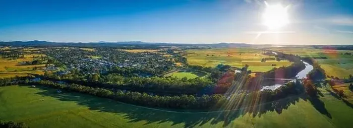 Framed Print : Snowy River meanders around small rural town and meadows at sunset - aerial panoramic landscape Framed Print : Snowy River meanders around small rural town and meadows at sunset - aerial panoramic landscape