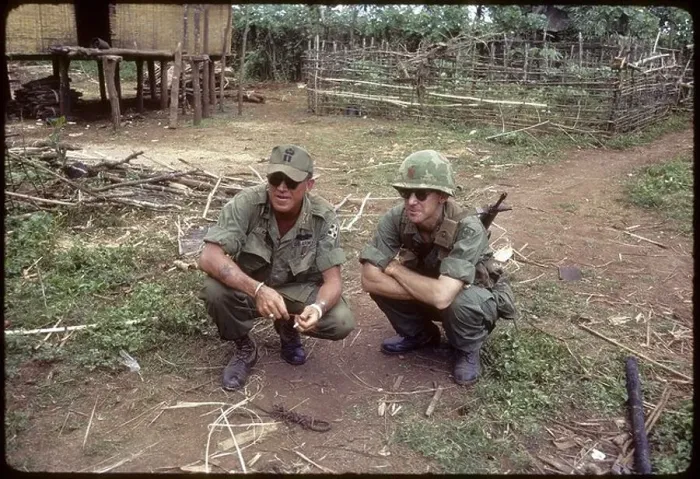 Framed Print : US soldiers squatting in village in the 4th Infantry Division's area of operations vietnam war pleiku Framed Print : US soldiers squatting in village in the 4th Infantry Division's area of operations vietnam war pleiku