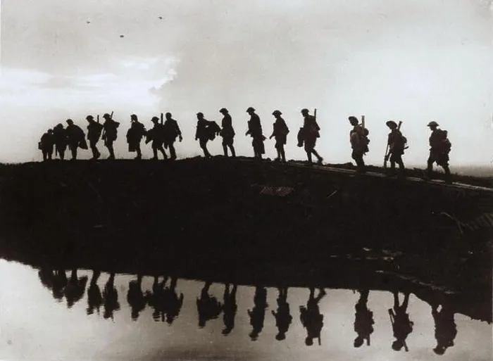 Framed Print : Soldiers walking up to the front in WW1 - they are silhouetted and reflected in a puddle of water Framed Print : Soldiers walking up to the front in WW1 - they are silhouetted and reflected in a puddle of water