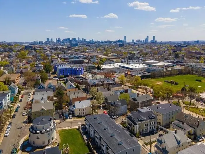 Framed Print : Somerville city center aerial view on Somerville Avenue with Boston skyline at the background in spring Framed Print : Somerville city center aerial view on Somerville Avenue with Boston skyline at the background in spring