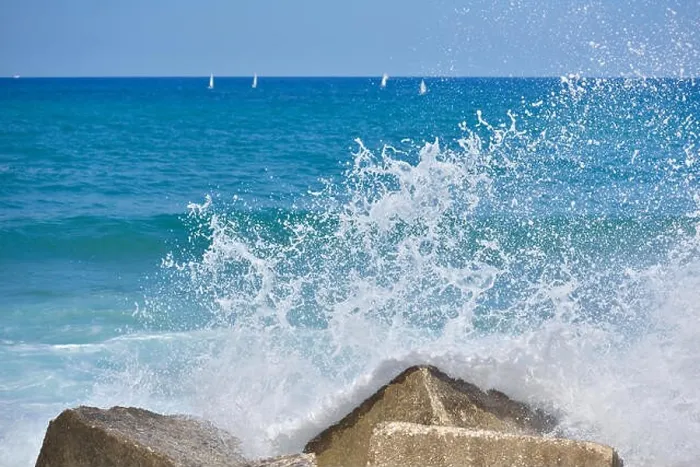 Framed Print : Splash water of sea wave attack to the rock phot with outdoor sunny lighting Framed Print : Splash water of sea wave attack to the rock phot with outdoor sunny lighting