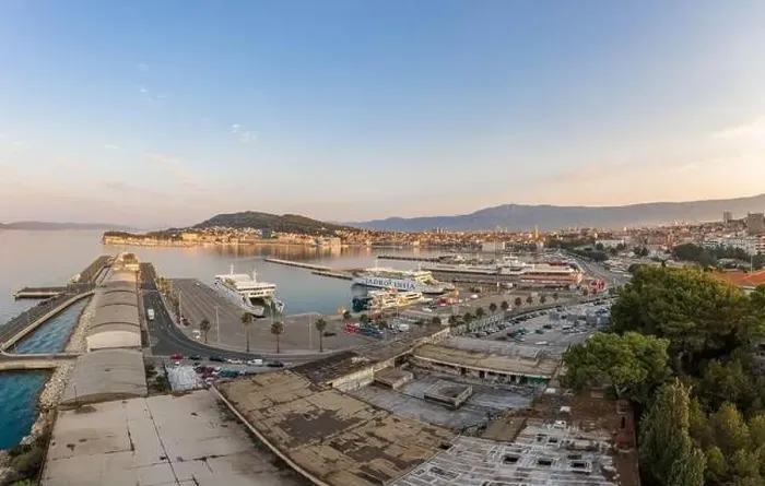 Framed Print : Split, Croatia - Aug 14, 2020: Aerial drone shot of ferry port at old town port in sunrise hour