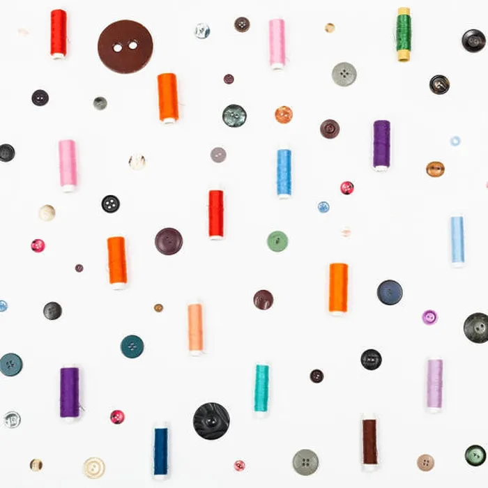 Framed Print : many spools of sewing thread and various buttons Framed Print : many spools of sewing thread and various buttons