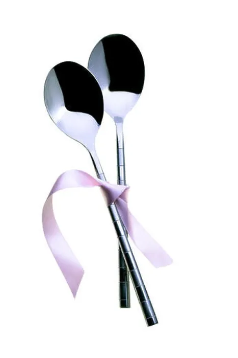 Framed Print : Two spoons tied together with pink ribbon. On a white background Framed Print : Two spoons tied together with pink ribbon. On a white background