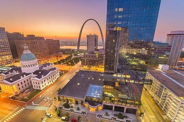 St. Louis, Missouri, USA downtown cityscape with the arch and courthouse at dusk