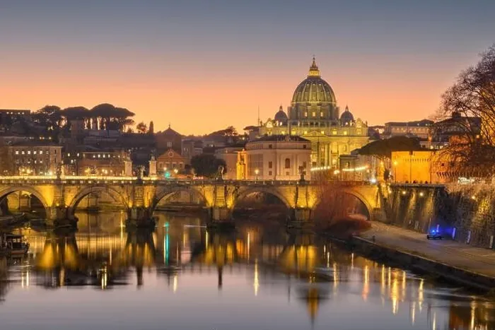 Framed Print : St. Peter's Basilica in Vatican City with the Tiber River passing through Rome, Italy at dusk Framed Print : St. Peter's Basilica in Vatican City with the Tiber River passing through Rome, Italy at dusk