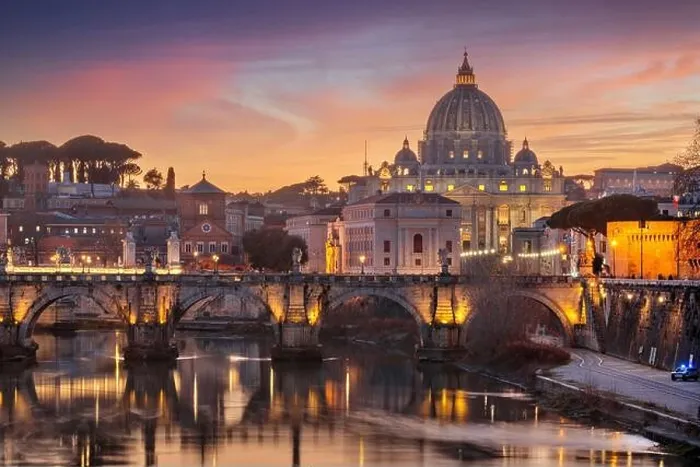 Framed Print : St. Peter's Basilica in Vatican City on the Tiber River through Rome, Italy at dusk Framed Print : St. Peter's Basilica in Vatican City on the Tiber River through Rome, Italy at dusk