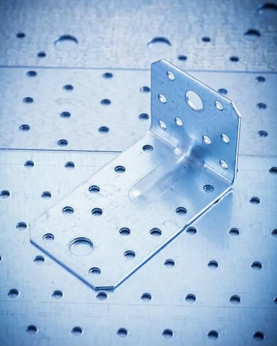 Framed Print : Stainless angle bar on perforated metallic sheet construction concept Framed Print : Stainless angle bar on perforated metallic sheet construction concept
