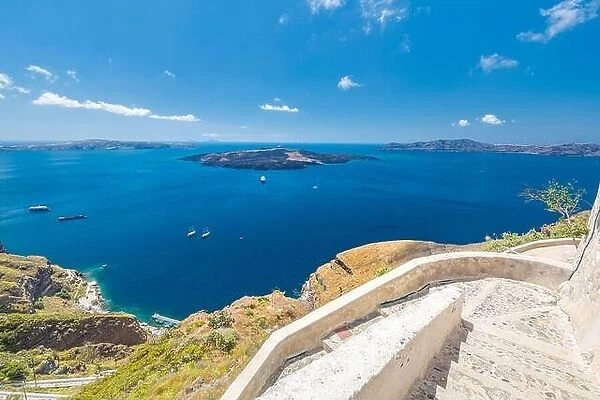 Stairs from Santorini caldera, view of blue sea bay. Amazing travel landscape, summer vacation, boats in volcano bay