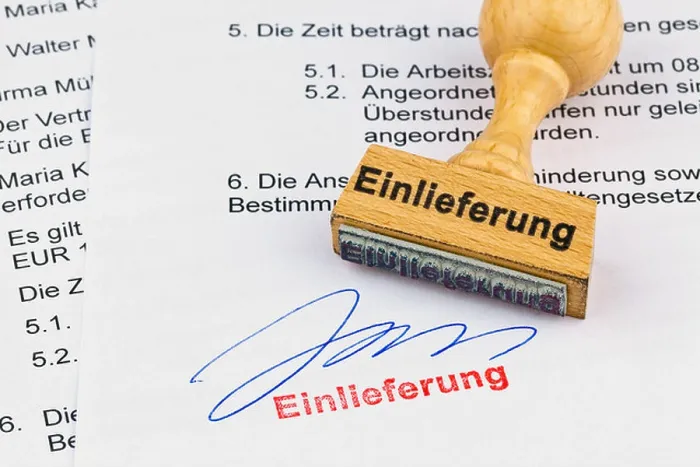 Framed Print : A stamp of wood lies on a document Framed Print : A stamp of wood lies on a document