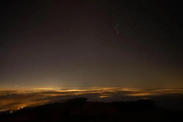 Framed Print : Starry Night Sky Over Clouds Illuminated by Distant City Lights Framed Print : Starry Night Sky Over Clouds Illuminated by Distant City Lights