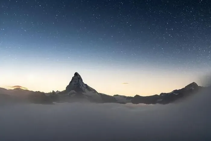 Framed Print : Stars in the night sky over Matterhorn peak emerging from fog, Zermatt, Valais canton, Switzerland Framed Print : Stars in the night sky over Matterhorn peak emerging from fog, Zermatt, Valais canton, Switzerland