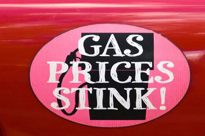 Framed Print : A sticker that has 'GAS PRICES STINK' affixed on an automobile Framed Print : A sticker that has 'GAS PRICES STINK' affixed on an automobile