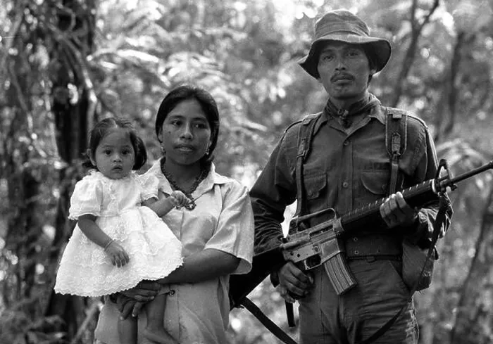 Framed Print : Stock image of a URNG guerrilla with his family in the Ixcan Jungle Guatemala Framed Print : Stock image of a URNG guerrilla with his family in the Ixcan Jungle Guatemala