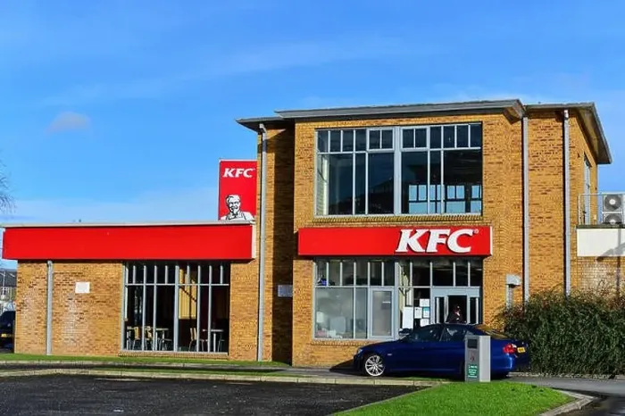 Framed Print : Stock Photo - KFC Kentucky Fried Chicken Drive Thru red sign with Colonel Sanders on roadside with blue sky Framed Print : Stock Photo - KFC Kentucky Fried Chicken Drive Thru red sign with Colonel Sanders on roadside with blue sky