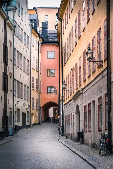 Framed Print : STOCKHOLM, SWEDEN - October 14, 2016: View from narrow and idyllic street with colorful buildings in Gamla Stan. The Old Town in Stockholm, Sweden. Cl