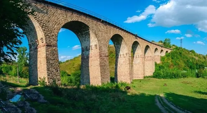 Framed Print : Stone railway ancient arch bridge over green valley Framed Print : Stone railway ancient arch bridge over green valley
