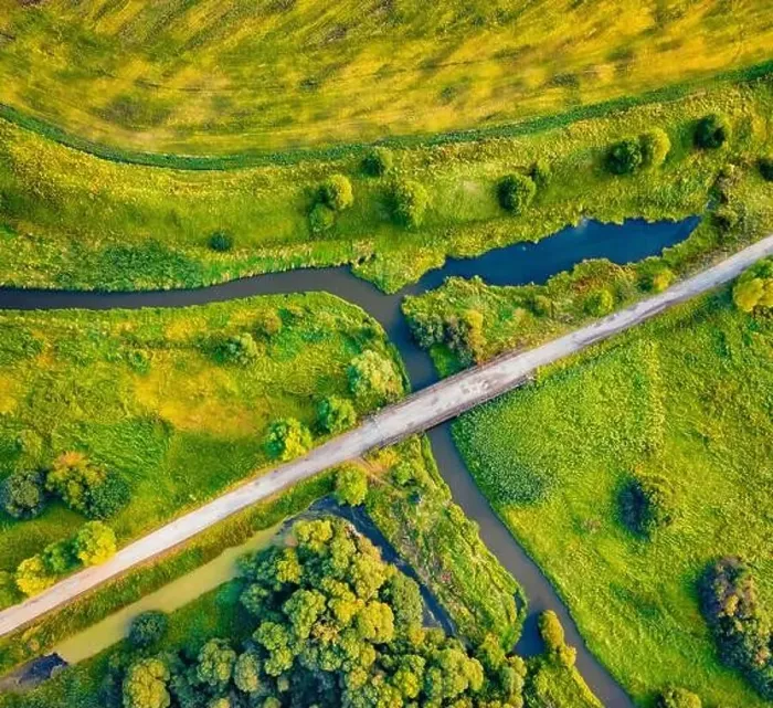 Framed Print : Straight dawn view from flying drone of bridge over small river Framed Print : Straight dawn view from flying drone of bridge over small river