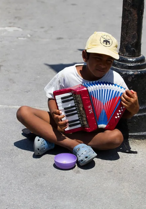 Framed Print : A street beggar or gypsy playing a small hand organ to try and raise donations from the public Framed Print : A street beggar or gypsy playing a small hand organ to try and raise donations from the public