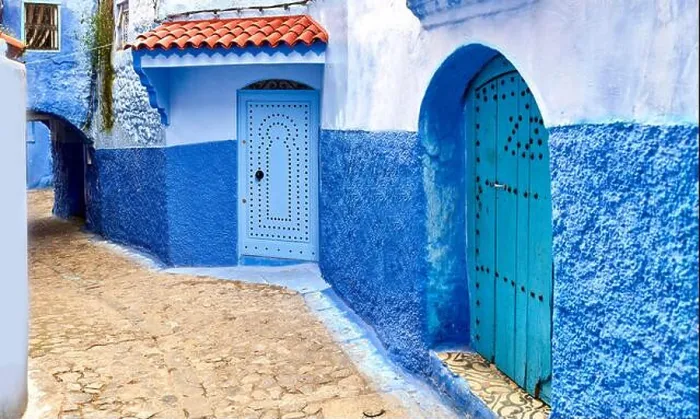 Framed Print : Streets and colored houses, View from the city street where all buildings are painted only in blue Framed Print : Streets and colored houses, View from the city street where all buildings are painted only in blue