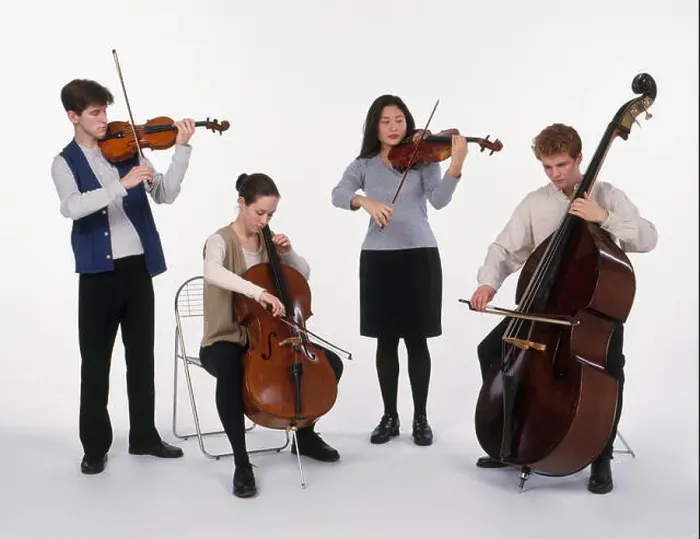 Framed Print : String quartet consisting of a group of teenagers playing violin, cello, viola and double bass Framed Print : String quartet consisting of a group of teenagers playing violin, cello, viola and double bass