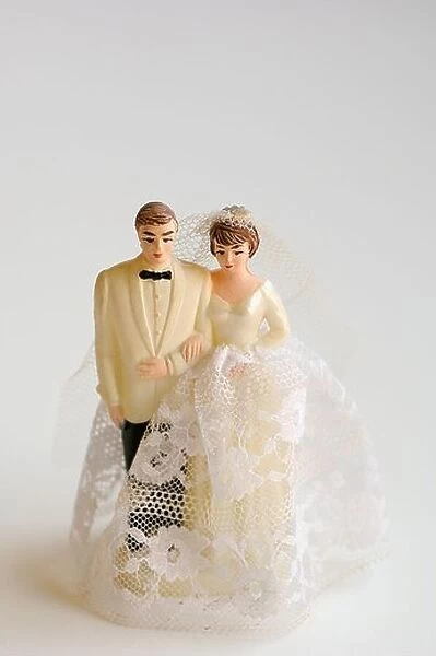 Studio shot of bride and groom figurines