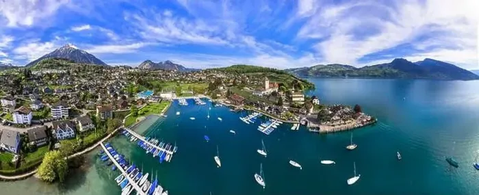 Framed Print : Stunning aerial drone panorama of lake Thun and the Spiez village with medieval castle Framed Print : Stunning aerial drone panorama of lake Thun and the Spiez village with medieval castle