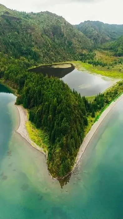 Framed Print : A stunning aerial photograph showcases a majestic lake surrounded by rich green forests in the Azores The serene water Framed Print : A stunning aerial photograph showcases a majestic lake surrounded by rich green forests in the Azores The serene water