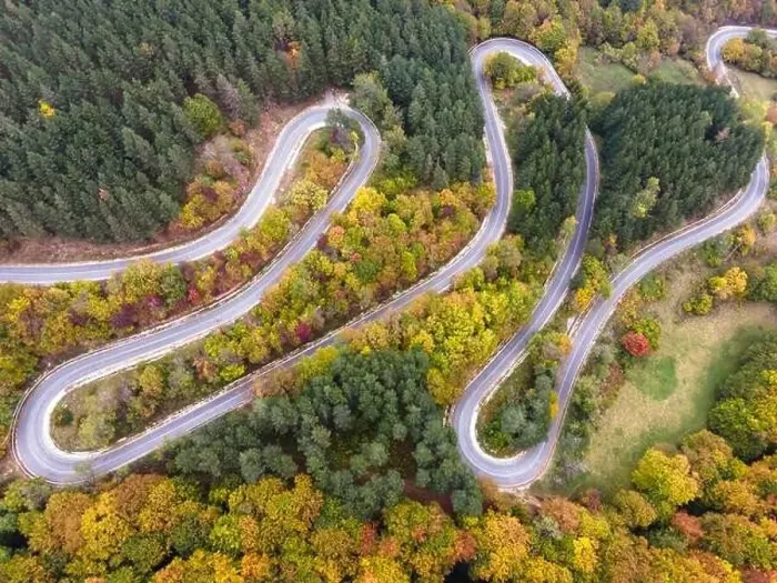Framed Print : Stunning aerial view of road with curves crossing dense forest in autumn colors in Bulgaria. High quality photo Framed Print : Stunning aerial view of road with curves crossing dense forest in autumn colors in Bulgaria. High quality photo