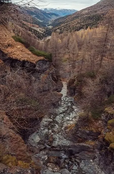 Framed Print : Stunning drone footage of an alpine valley in Autumn with different coloured trees Framed Print : Stunning drone footage of an alpine valley in Autumn with different coloured trees