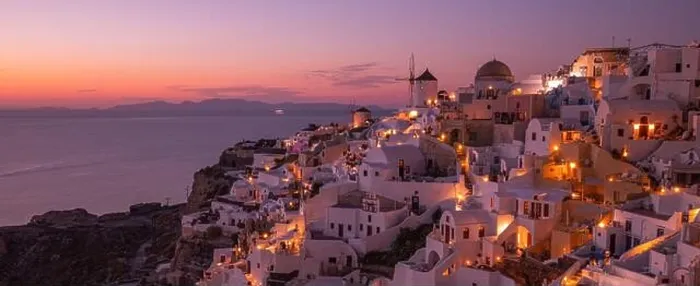 Framed Print : Stunning sunset landscape. Beautiful view of fabulous village of Oia with traditional white houses and windmills in Santorini island at night, Greece Framed Print : Stunning sunset landscape. Beautiful view of fabulous village of Oia with traditional white houses and windmills in Santorini island at night, Greece