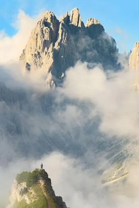 Framed Print : Stunning view of a tourist on the top of a hill enjoying the view of the Cadini di Misurina during a cloudy day Framed Print : Stunning view of a tourist on the top of a hill enjoying the view of the Cadini di Misurina during a cloudy day