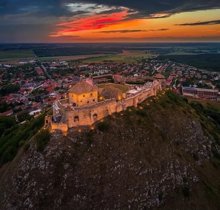 Framed Print : Sumeg, Hungary - Aerial view of the famous illuminated High Castle of Sumeg in Veszprem county at sunset with colorful Framed Print : Sumeg, Hungary - Aerial view of the famous illuminated High Castle of Sumeg in Veszprem county at sunset with colorful