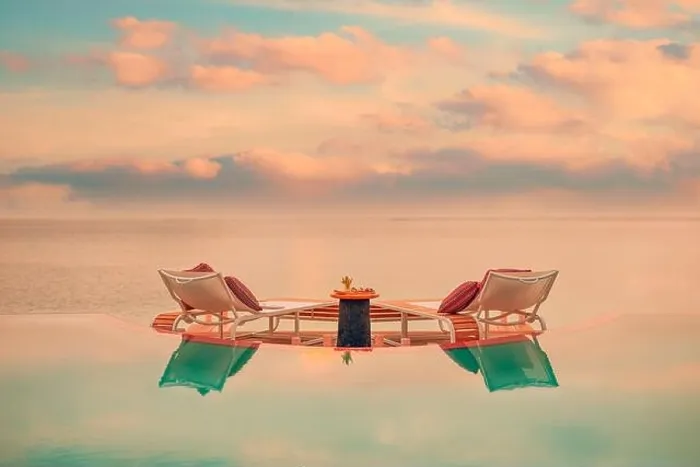 Framed Print : Summer love and romance table setup for a romantic dinner meal with luxury infinity pool reflection chairs under sunset sky and sea in background Framed Print : Summer love and romance table setup for a romantic dinner meal with luxury infinity pool reflection chairs under sunset sky and sea in background
