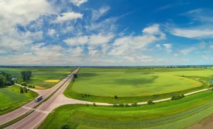 Framed Print : Summer rural landscape, aerial view. View of green fields, forest, village and highway Framed Print : Summer rural landscape, aerial view. View of green fields, forest, village and highway